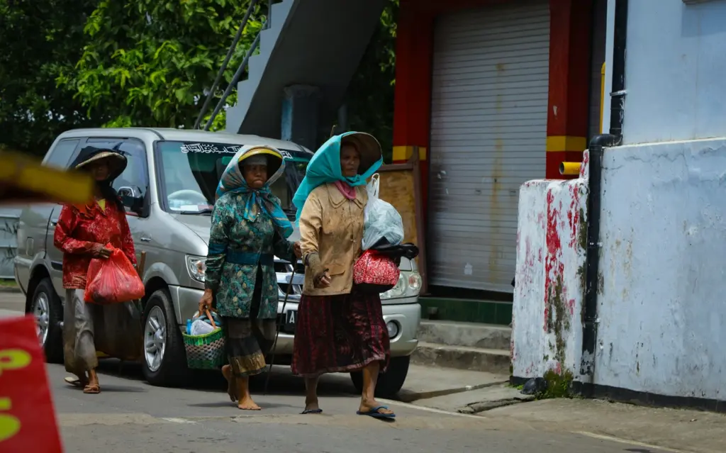 A group of women walking down the street
