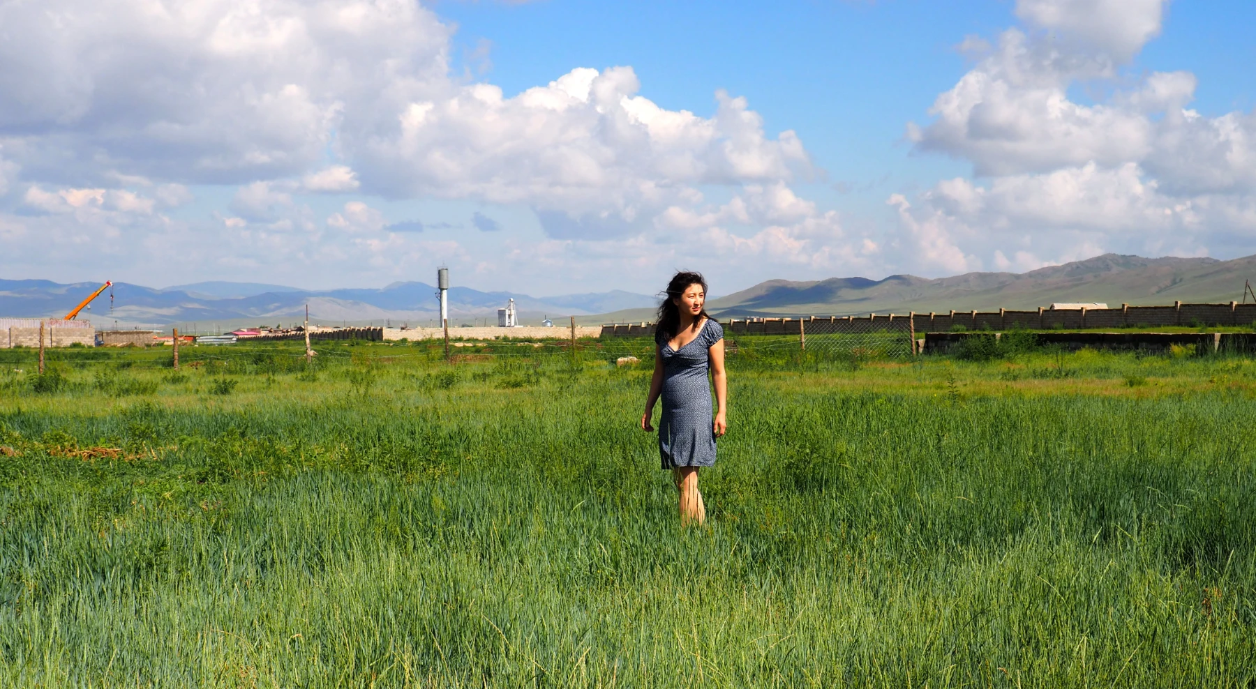 women standing in mushroom farm land