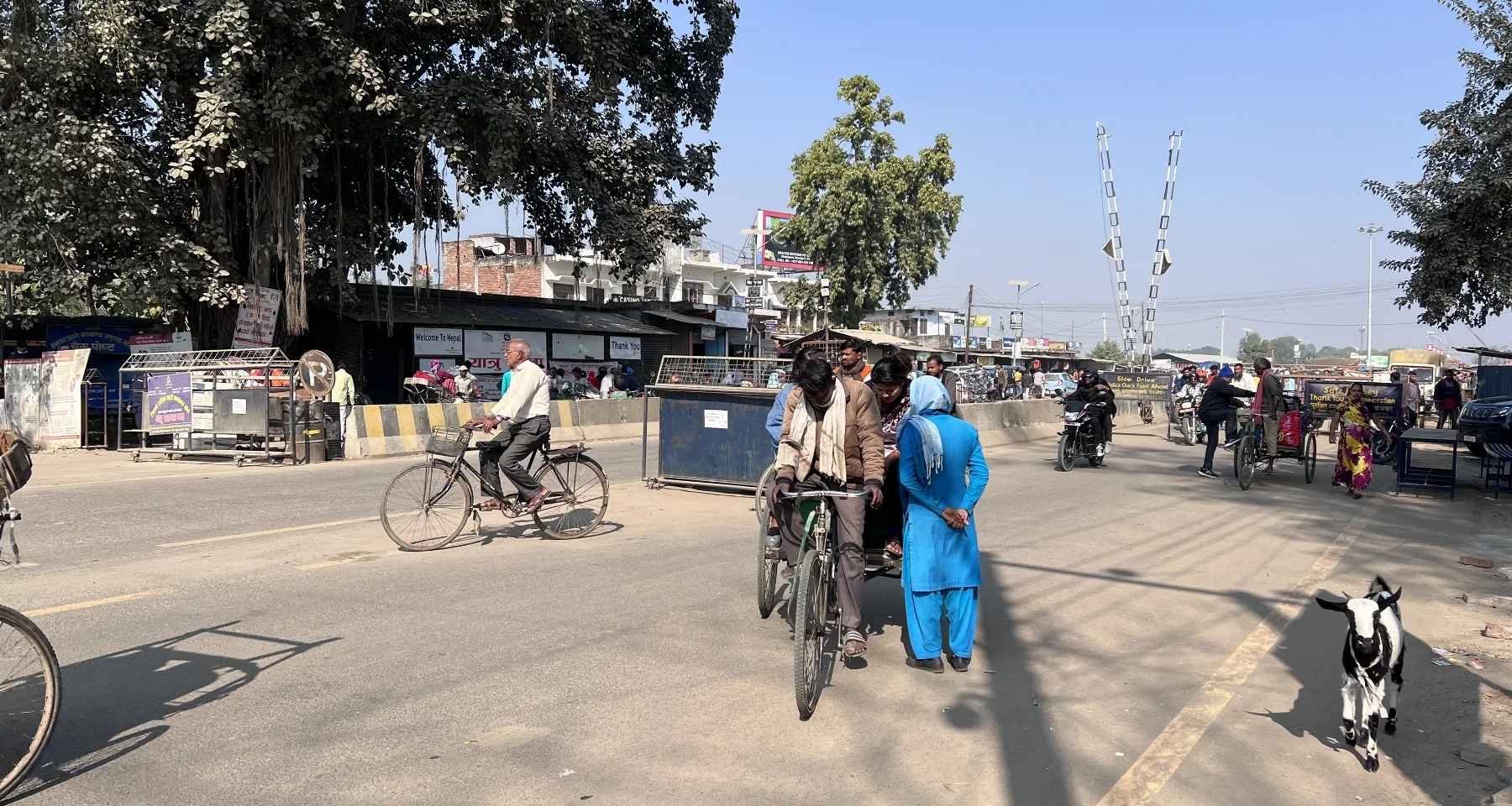 A woman questions two people on a rickshaw while they are attempting to cross the Nepalgunj border, as part of her job description to monitor cross-border trafficking cases.