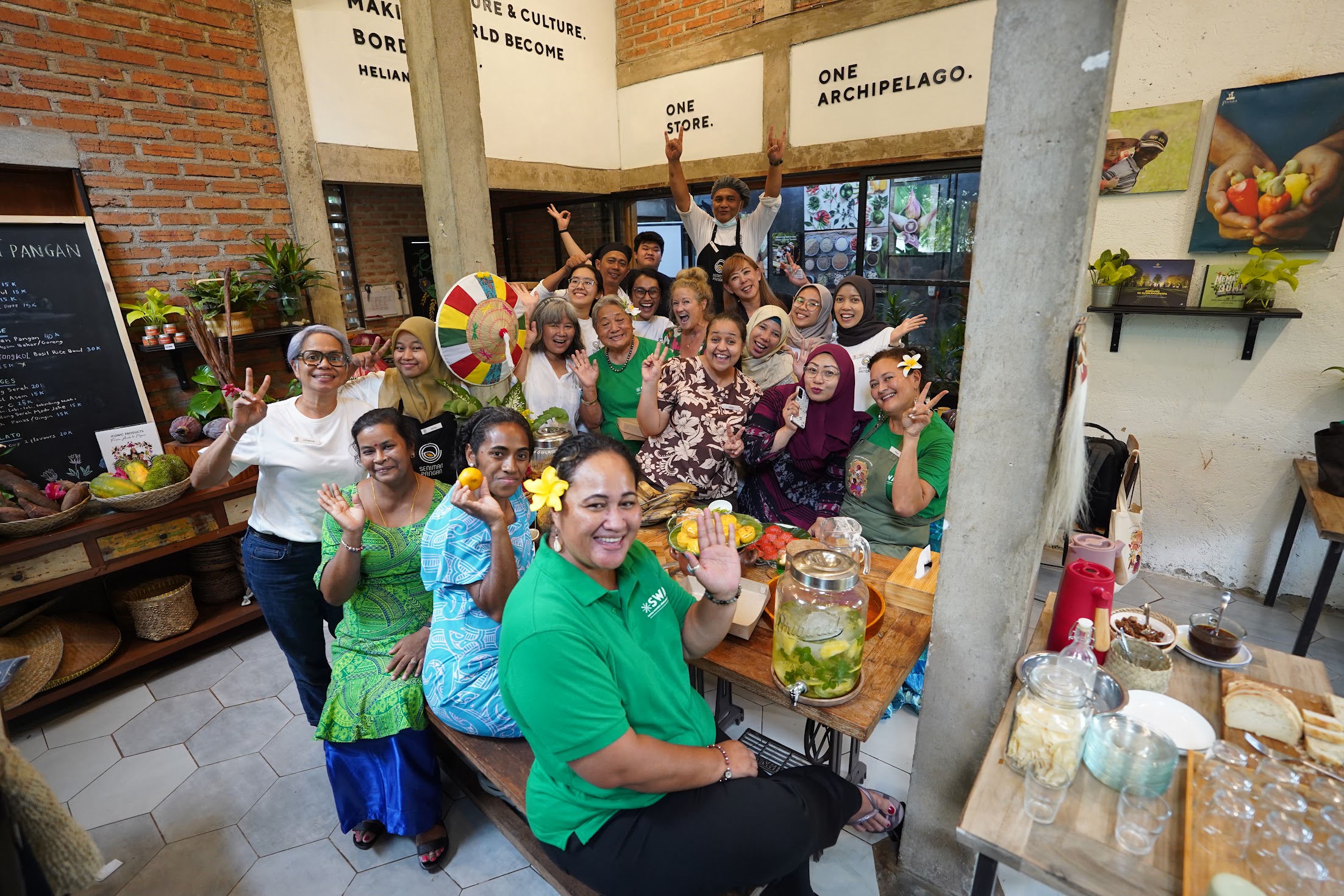 women entrepreneurs from the pacific islands gathered in a table with food ingredients